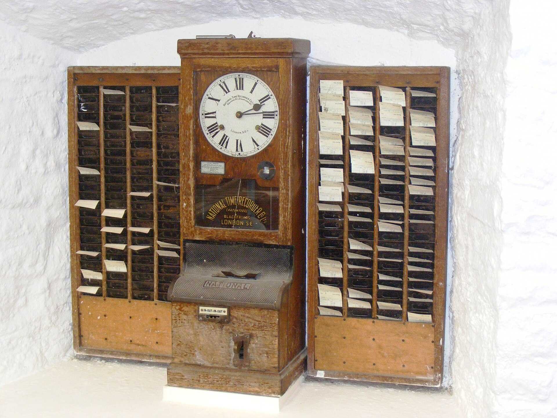 Vintage punch-card time clock used to record hours worked