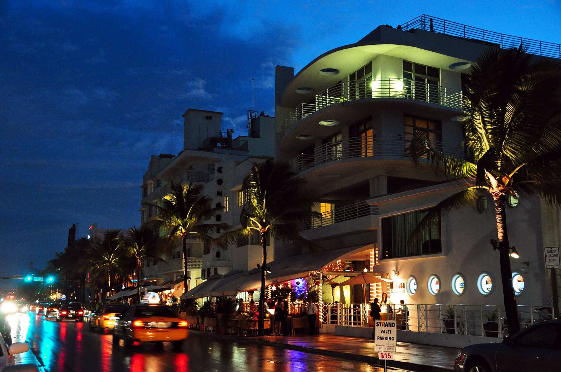 Neon-lit Ocean Drive in South Beach, Miami, at night