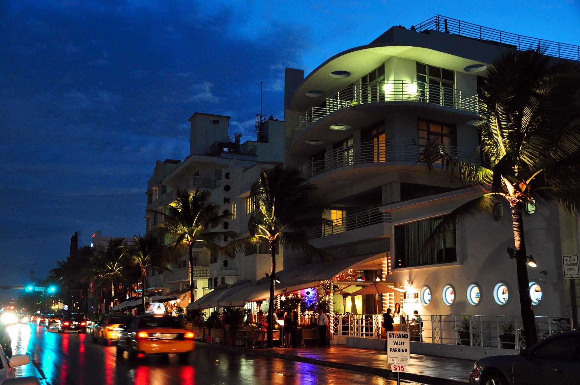 Neon-lit Ocean Drive in South Beach, Miami, at night