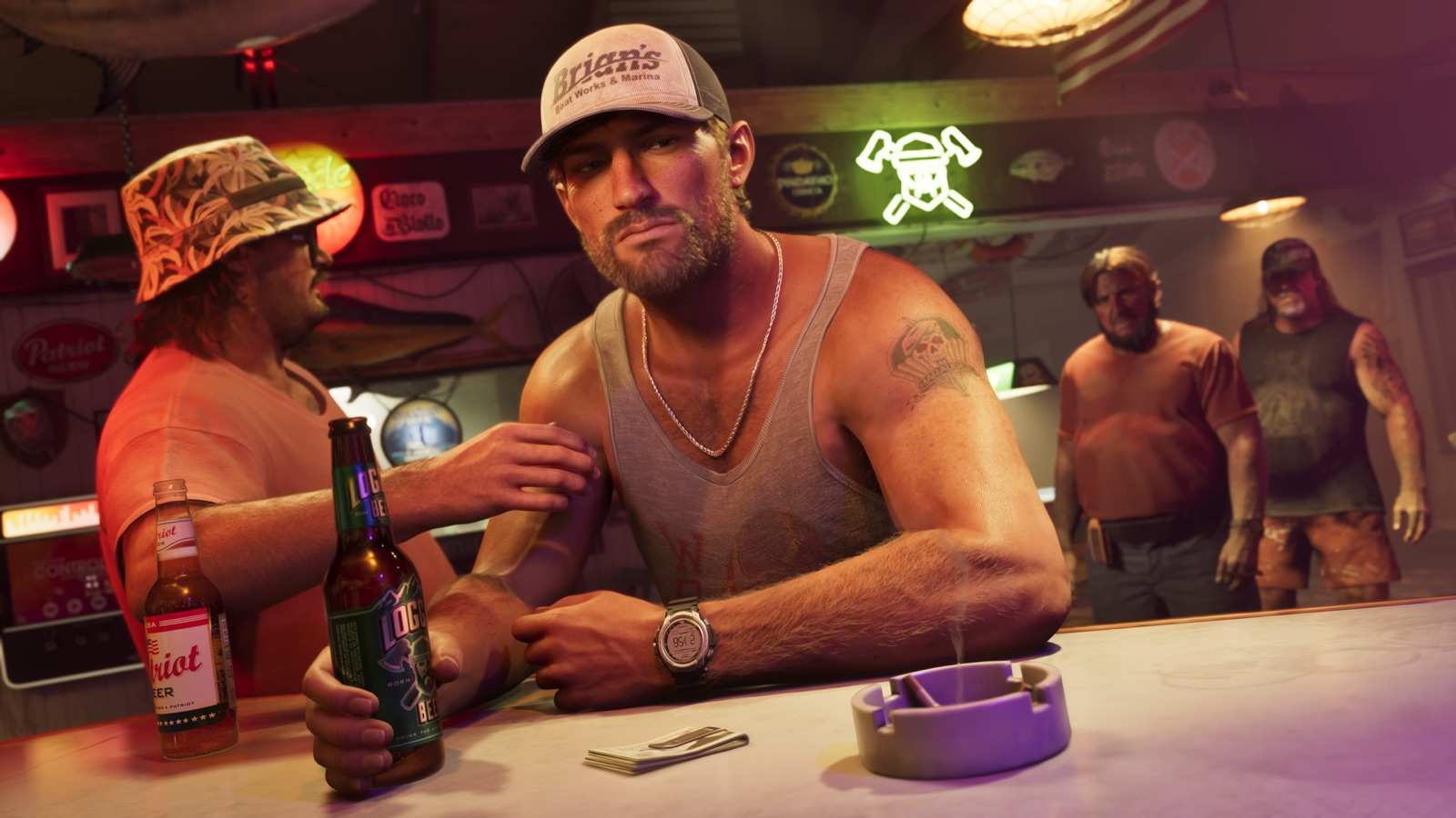 Jason drinking a beer at a bar counter with a group of men